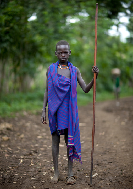 Menit boy holding a stick, Tum market, Omo valley, Ethiopia