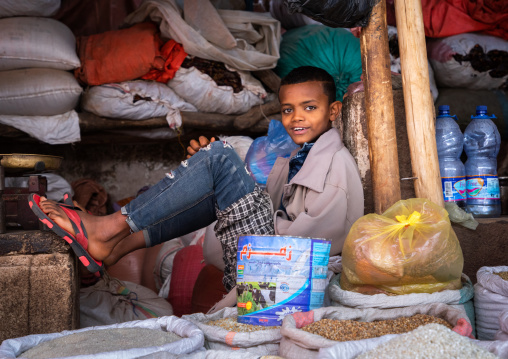Ethiopian boy seller in the market, Harari region, Harar, Ethiopia