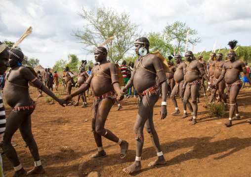 Bodi tribe fat men during Kael ceremony, Omo valley, Hana Mursi, Ethiopia