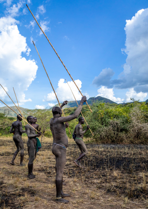 Suri tribe warriors parading before a donga stick fighting ritual, Omo valley, Kibish, Ethiopia