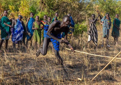 Suri tribe warriors fighting during a donga stick ritual, Omo valley, Kibish, Ethiopia