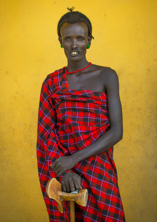 Dassanech Tribe Man Holding Headrests, Omorate, Omo Valley, Ethiopia