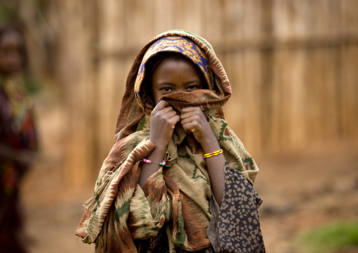 Portrait Of A Shy Borana Tribe Girl Hiding Behind Her Scarf, Yabello, Omo Valley, Ethiopia