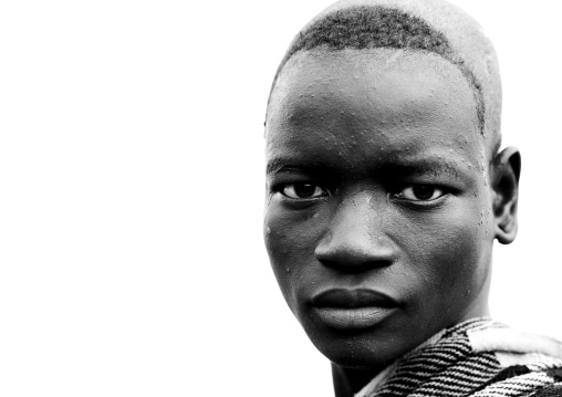Black And White Portrait Of A Bodi Tribe Man With Shaved Head, Hana Mursi, Omo Valley, Ethiopia