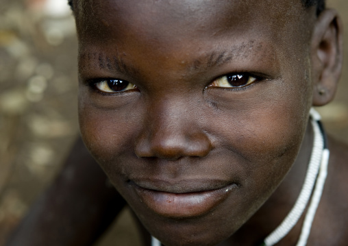 Close-up Portrait Of A Bashada Tribe Kid With Cut Eyebrows, Hana Mursi, Omo Valley, Ethiopia
