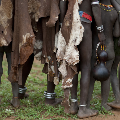 Group Of Hamer People Wearing Skin And Holding Calabash Ethiopia