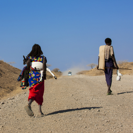 Afar girl carrying a goat, Assaita, Afar regional state, Ethiopia