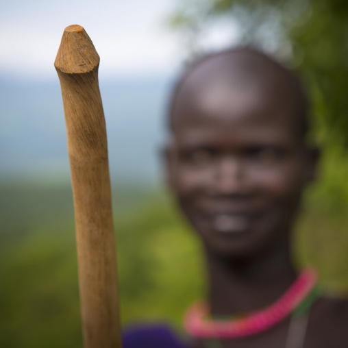 Suri tribe man holding a phallic stick, Tulgit, Omo valley, Ethiopia