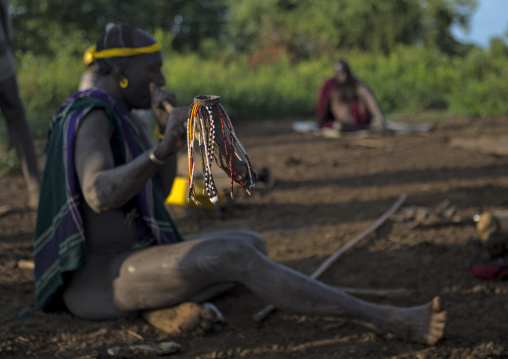 Bodi Tribe Man Waking Up The Village With A Flute, Hana Mursi, Omo Valley, Ethiopia