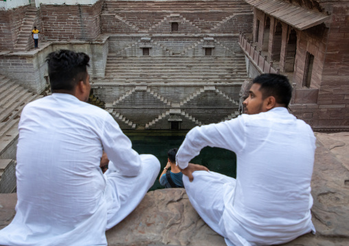 Indian men in toorji ka Jhalra stepwell, Rajasthan, Jodhpur, India