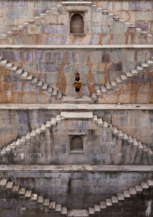 Western tourist in Nagar sagar Kund stepwell, Rajasthan, Bundi, India