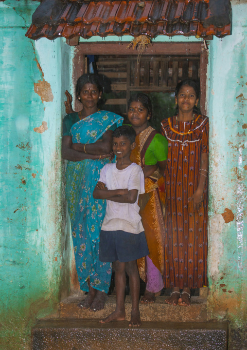 Mother Posing With Her Children On The Doorstep Of Their House Kanadukathan Chettinad, India
