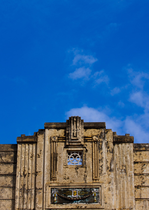 Adornment On The Top Of An Old Decrepit Building Over A Blue Sky, Kanadukathan Chettinad, India