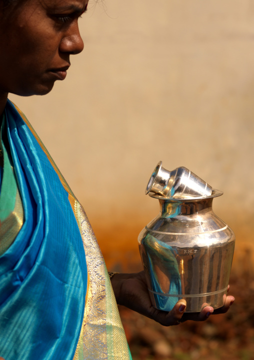 Woman In Sari Holding Wedding Gift In Her Hand During The Ceremony, Kanadukathan Chettinad, India