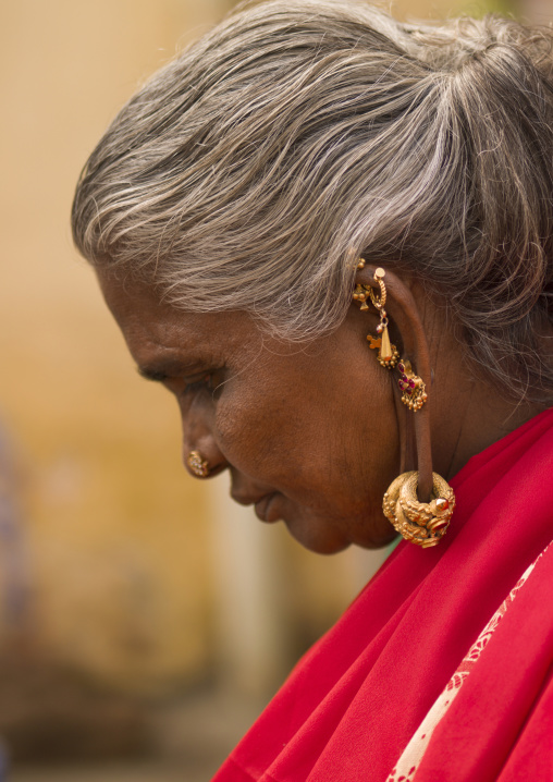 Hindu Woman With Several Earrings And Rings Hung At Her Ears, Madurai, India