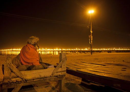 Old Man Sleeping On The Riverbank, Maha Kumbh Mela, Allahabad, India