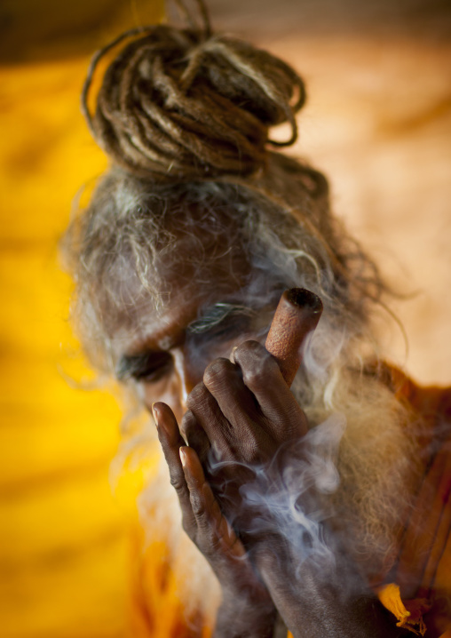 A Naga Sadhu Smoking Pot, Maha Kumbh Mela, Allahabad, India