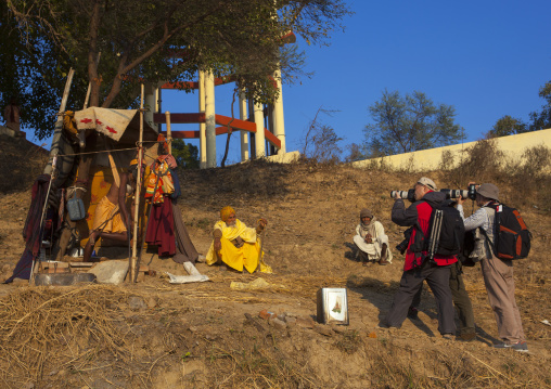 Chinese Tourists Taking Pictures Of A Naga Sadhu Standing On One Leg For One Year, Maha Kumbh Mela, Allahabad, India
