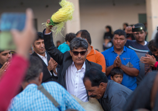 men dancing during a wedding ceremony, Hormozgan, Kushkenar, Iran