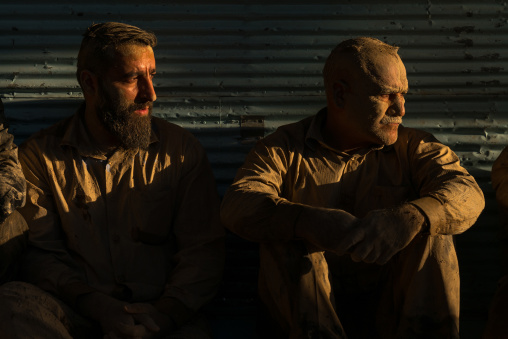 Iranian shiite muslim men with mud stains during the Ashura day, Lorestan Province, Khorramabad, Iran