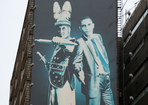 giant billboard showing barack obama with shmer, a villain in shia islam, on valiasr square, Central district, Tehran, Iran