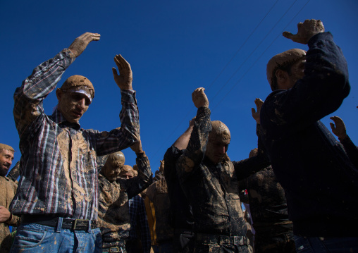 Iranian Shiite Muslim Men Covered In Mud, Chanting And Self-flagellating During Ashura, The Day Of The Death Of Imam Hussein, Kurdistan Province, Bijar, Iran