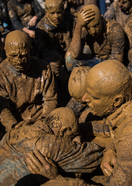 Iranian Shiite Muslim Men Covered In Mud Crying Together During Ashura, The Day Of The Death Of Imam Hussein, Kurdistan Province, Bijar, Iran