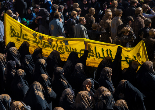 Iranian Shiite Muslim Women And Men Covered In Mud, Chanting And Self-flagellating During Ashura, The Day Of The Death Of Imam Hussein, Kurdistan Province, Bijar, Iran