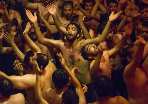 Iranian Shiite Muslim Mourners From The Mad Of Hussein Community Chanting And Self-flagellating During Muharram, Isfahan Province, Kashan, Iran