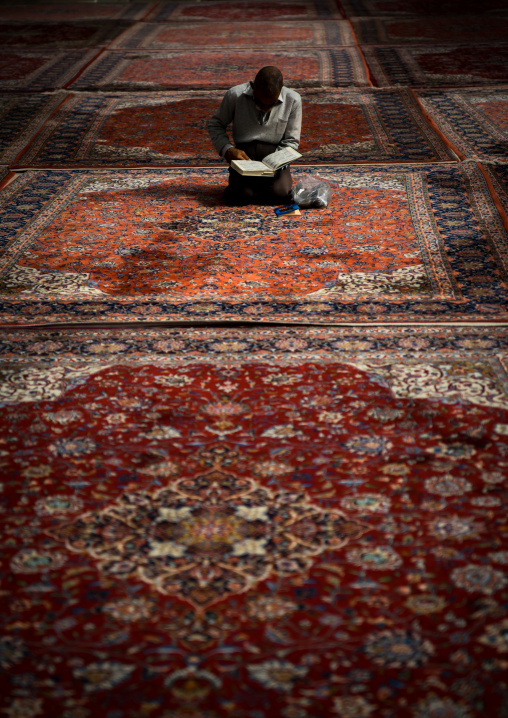 Iranian Shiite Muslim Man Reading The Koran In Fatima Al-masumeh Mosque, Fars Province, Shiraz, Iran