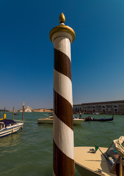Striped wooden pole, Veneto Region, Venice, Italy