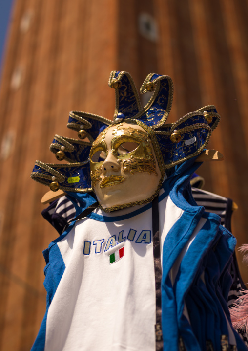 Masquerade mask abd a football shirt, Veneto Region, Venice, Italy