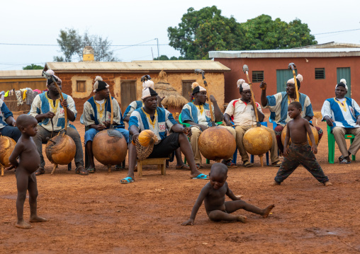 African musicians playing koras during Boloye dance of the panther man, Savanes district, Waraniene, Ivory Coast