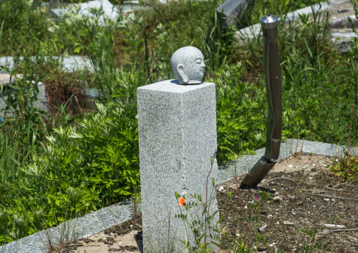 The remains of a destroyed cemetery after the 2011 earthquake and tsunami, Fukushima prefecture, Namie, Japan