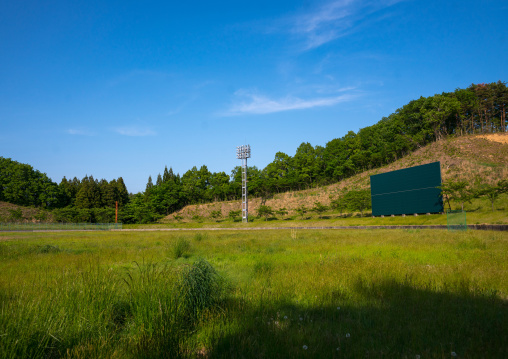 Baseball field in the highly contaminated area after the daiichi nuclear power plant explosion, Fukushima prefecture, Iitate, Japan