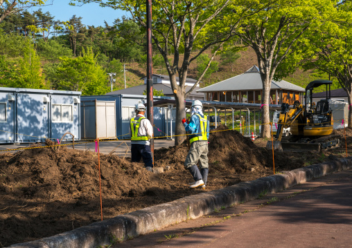 Decontamination work no entry sign in front of workers who remove top soil contaminated by nuclear radiations after the daiichi nuclear power plant explosion, Fukushima prefecture, Iitate, Ja