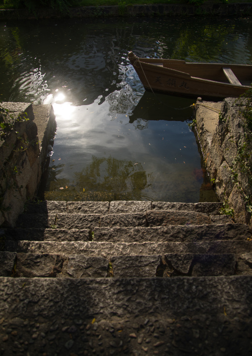 Boat moored at riverbank, Okayama Prefecture, Kurashiki, Japan