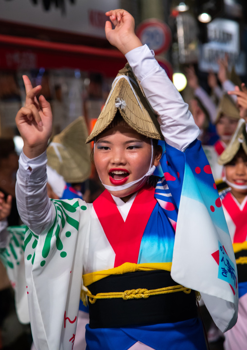 Japanese girl with straw hat during the Koenji Awaodori dance summer street festival, Kanto region, Tokyo, Japan