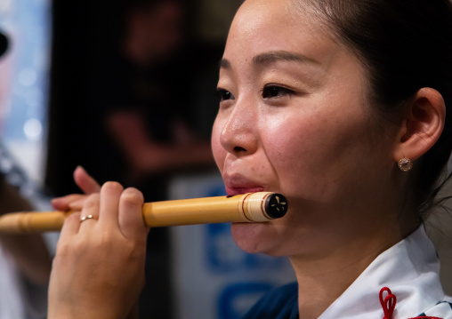 Japanese musician during the Koenji Awaodori dance summer street festival, Kanto region, Tokyo, Japan