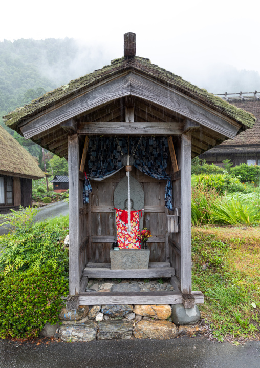 Japanese stone statue in a small shinto shrine, Kyoto Prefecture, Miyama, Japan