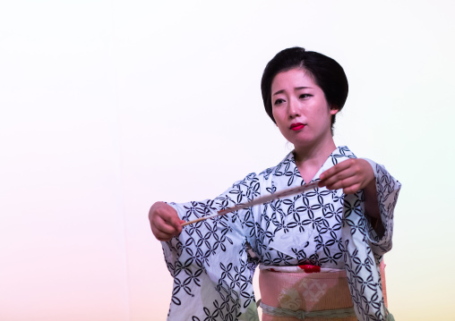 Maiko woman dancing on stage during a stage, Kansai region, Kyoto, Japan