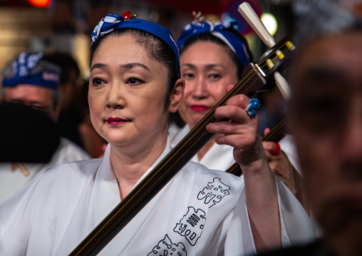 Japanese musicians during the Koenji Awaodori dance summer street festival, Kanto region, Tokyo, Japan