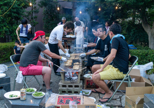 Japanese people making a barebecue in Higashichaya old town, Ishikawa Prefecture, Kanazawa, Japan