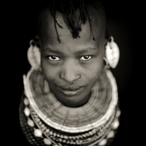 Turkana tribe woman with huge necklaces and earrings, Turkana lake, Loiyangalani, Kenya