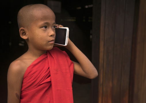 Novice Monk Calling On A Mobile Phone  In Nat Taung Kyaung Monastery, Bagan, Myanmar