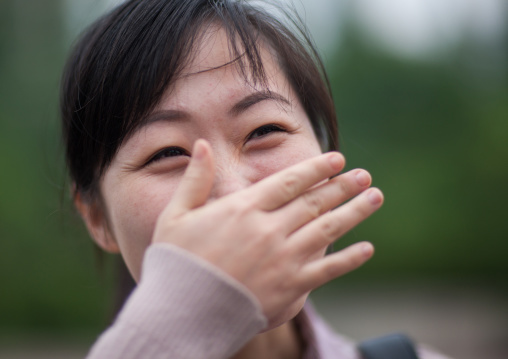 Portrait of a shy North Korean woman, Pyongan Province, Pyongyang, North Korea