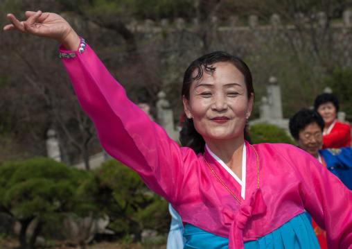 North Korean people dancing in a park for the day of the sun which is the birth anniversary of Kim Il-sung, Pyongan Province, Pyongyang, North Korea