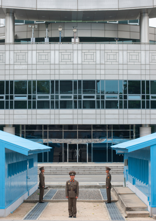 North Korean soldiers standing in front of the United Nations conference rooms on the demarcation line in the Demilitarized Zone, North Hwanghae Province, Panmunjom, North Korea