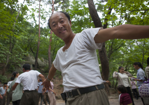 North Korean electricity company workers dancing in a park, North Hwanghae Province, Kaesong, North Korea