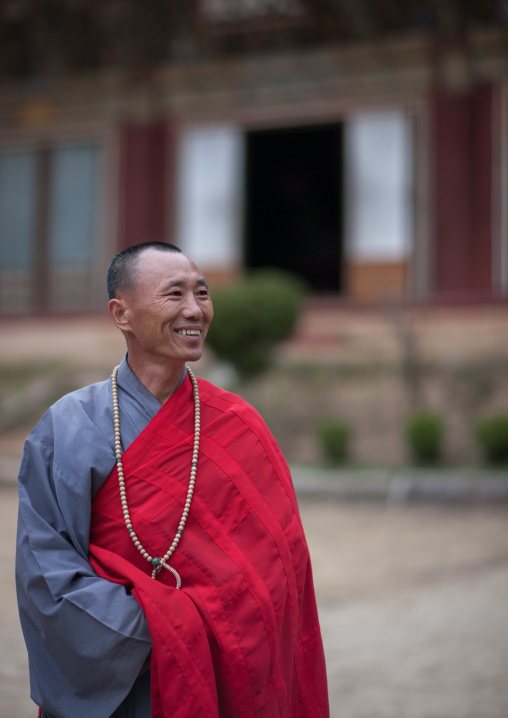 Smiling North Korean buddhist monk in kaesin sa temple on mount Chilbo, North Hamgyong province, Chilbosan, North Korea